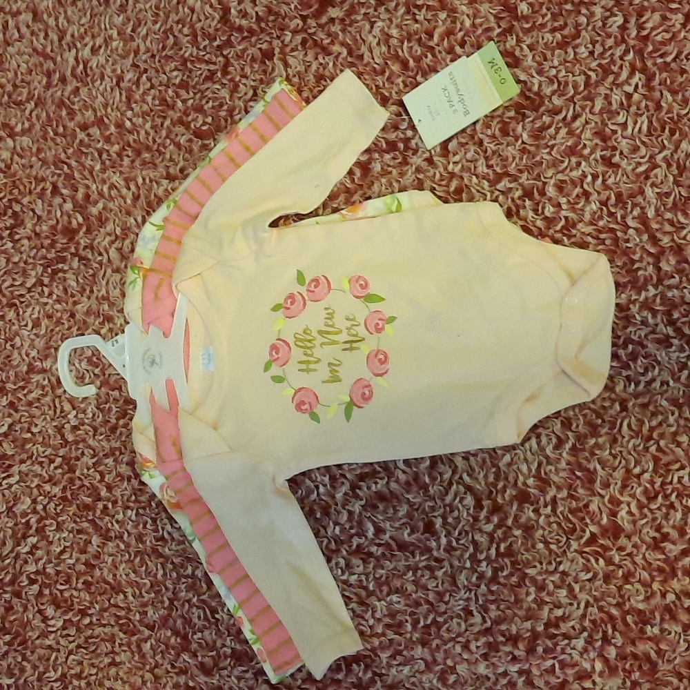 3 long sleeve 0-3 month brand new. Baby Kiss. Floral strips shades of pink.